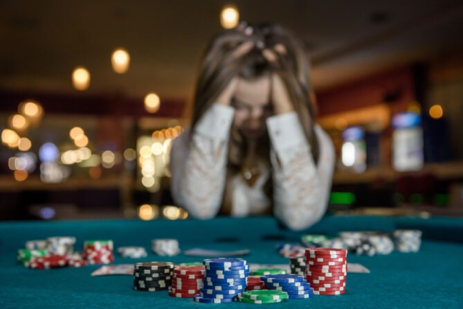 woman upset in casino for losing money
