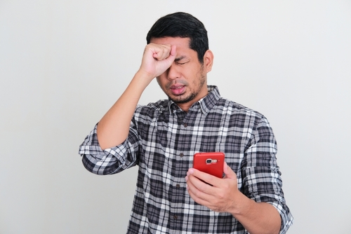 Man who is upset over mobile gambling loss